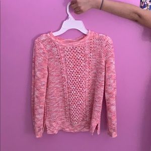 This a pink and white cute sweater